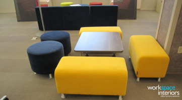 ETSU Charles C. Sherrod Library lounge seating featuring Alight benches and ottomans by Steelcase