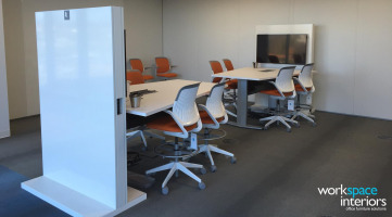 Eastman Corporate Business Center collaboration area with Mediascape table and Cobi chairs by Steelcase
