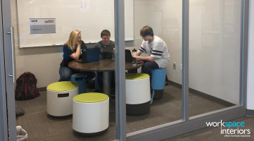 Dobyns-Bennett High School Excel breakout room with Steelcase Privacy Wall and students sitting on Buoy active seating stools by Turnstonekout room with a students sitting on Buoy active seating stools by Turnstone