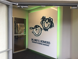 Dr. Brit E. Bowers, DDS pediatric dentistry entry wall with branded signage