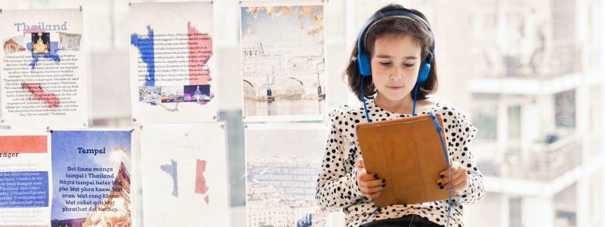 pretty pic of young girl studying with headphones